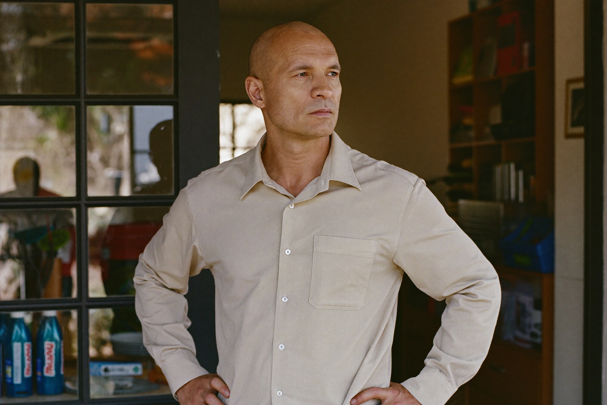 A small-business owner reviewing paperwork at their desk.